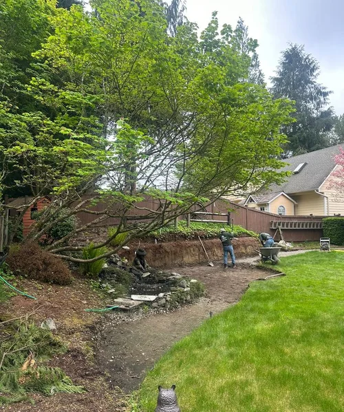 Installation of natural Grass, Retaining wall construction & Fire Pit in Lake Stevens 